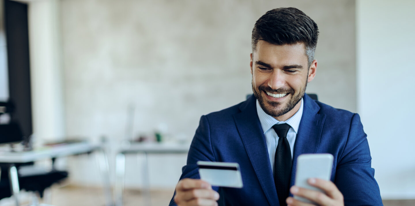 A man puts his card data into the app. A man puts his card data into the app.