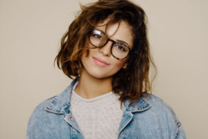 A young woman wearing glasses.