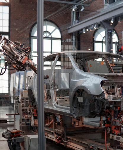 Manufacturing a car. Manufacturing a car.