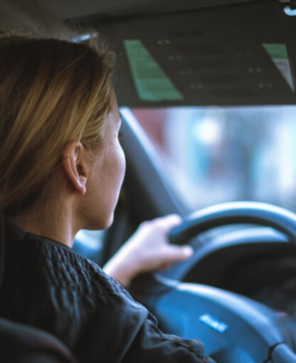 Woman driving a car.