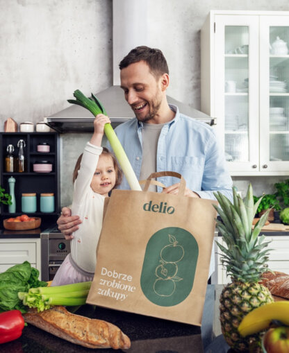 Father and daughter unpacking groceries from delio together.