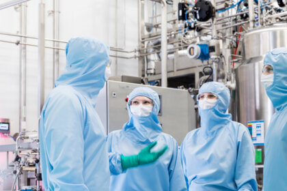 Polpharma Biologics' drug lab staff talking.