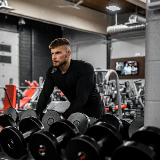 A man is getting ready to lift weights.