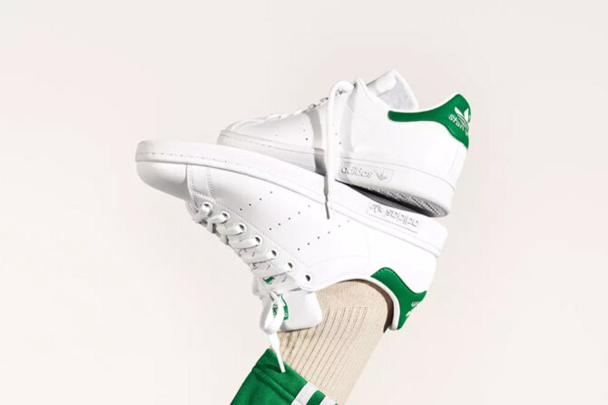 White Adidas sneakers.