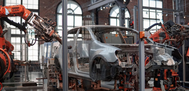 Manufacturing a car. Manufacturing a car.